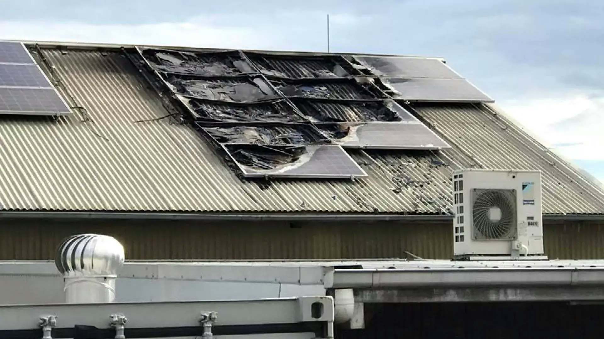 burned solar panels installed on a roof
