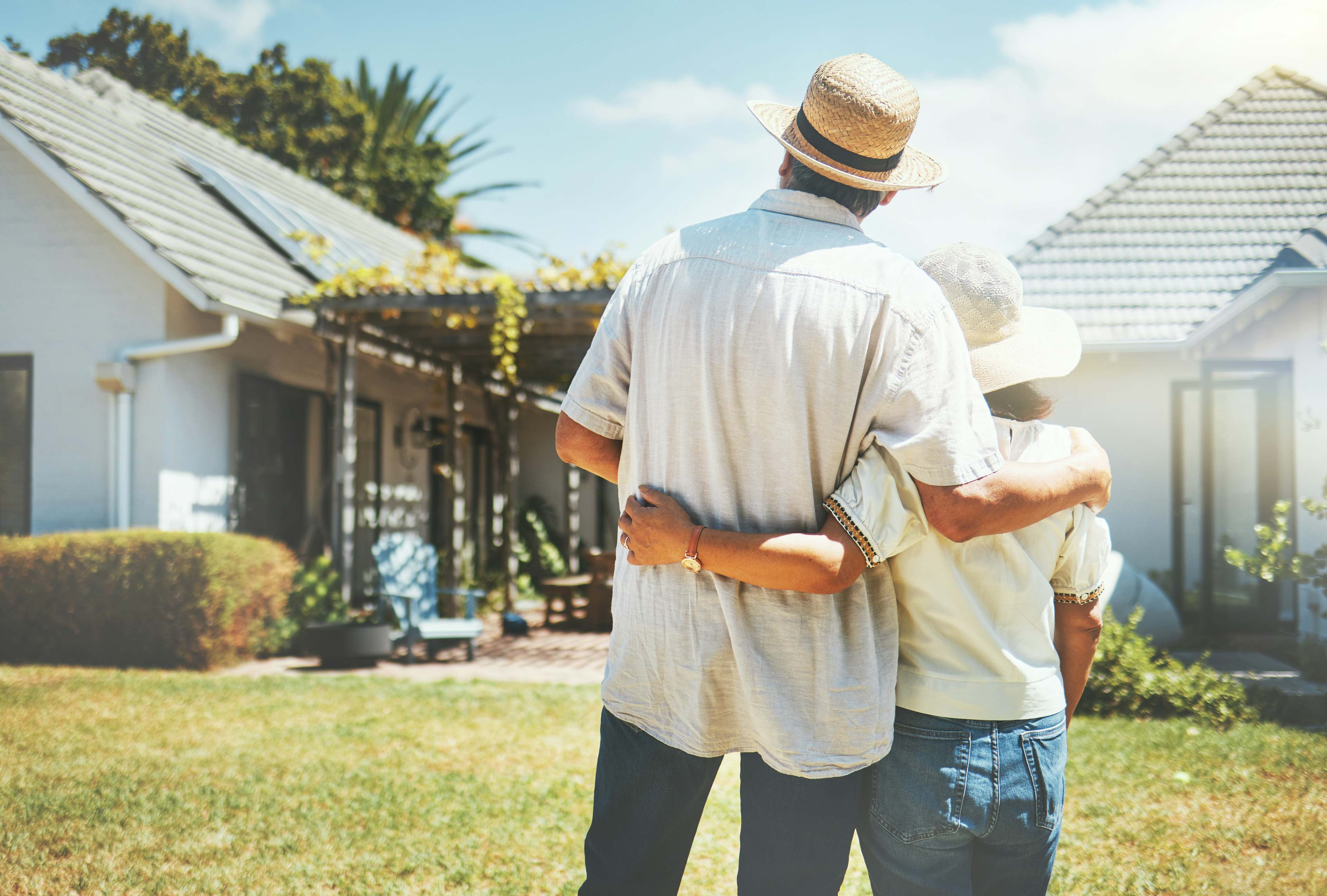 back view couple and hug outdoor at new home